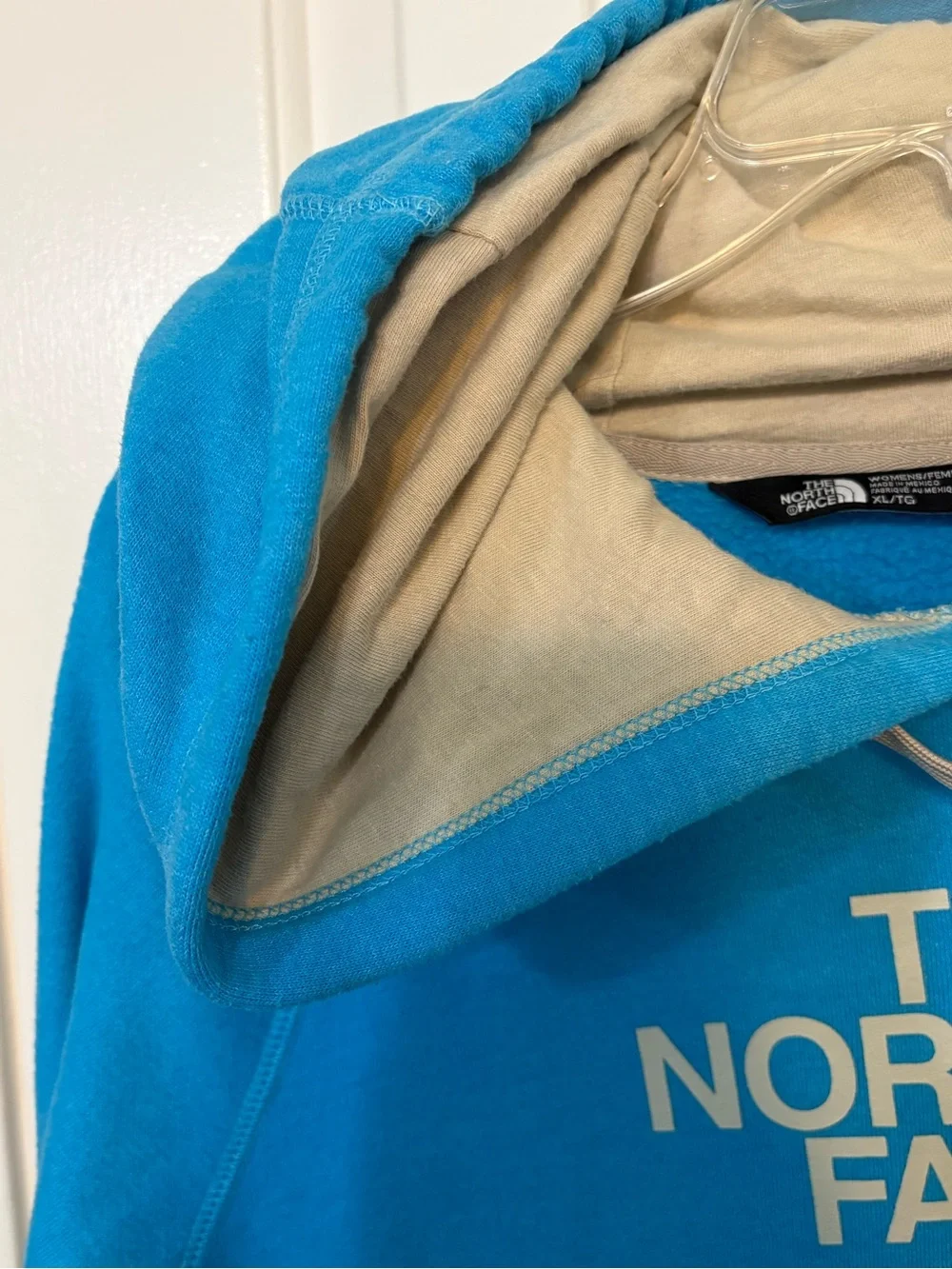The North Face Turquoise Pullover Hoodie with Cream Logo